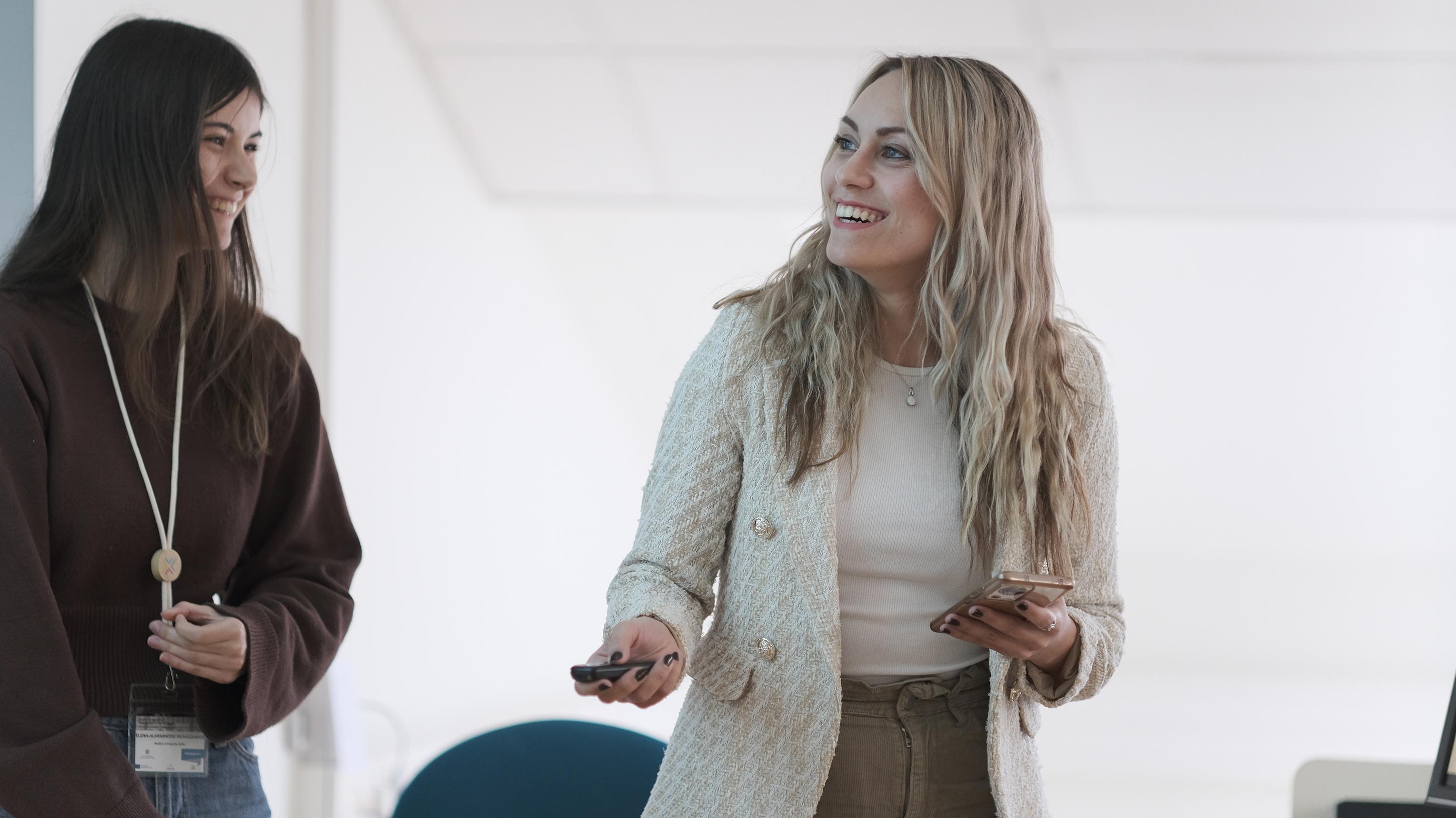 Two persons presenting their ideas