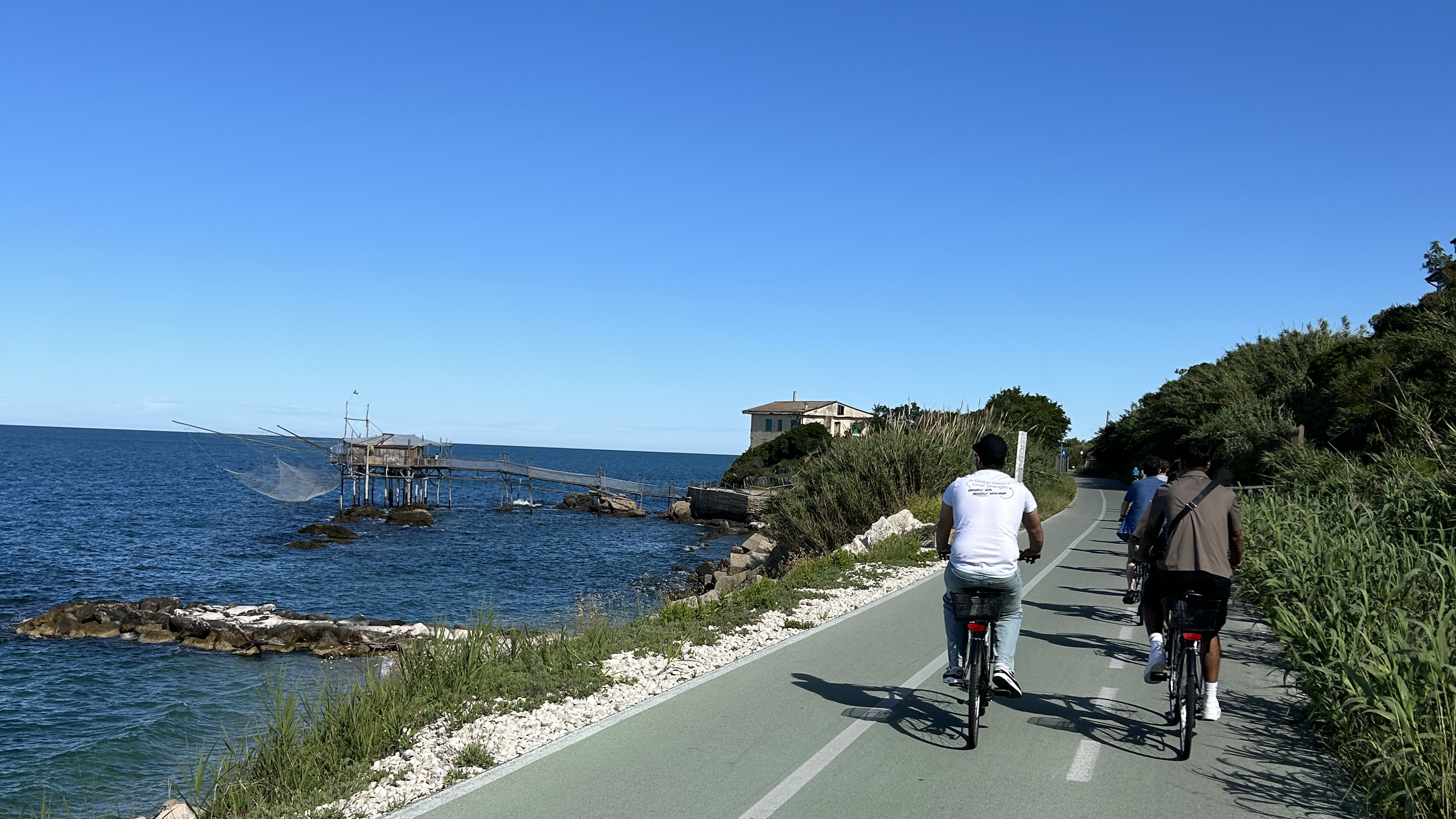Cyclist on a road by the Adriatic Sea.